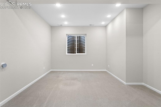 spare room with recessed lighting, carpet flooring, and baseboards