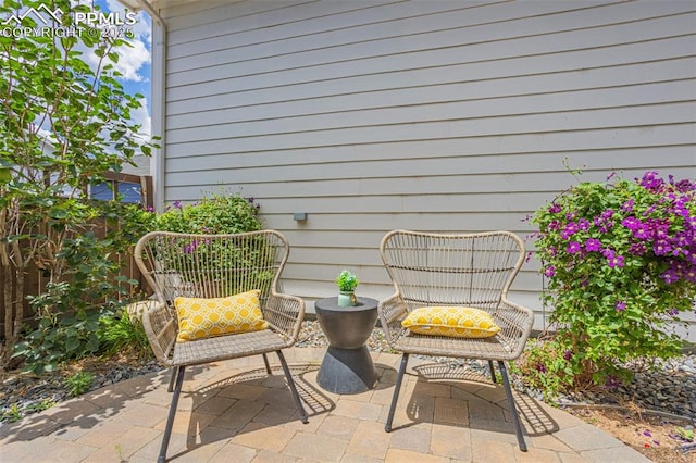 view of patio / terrace featuring fence