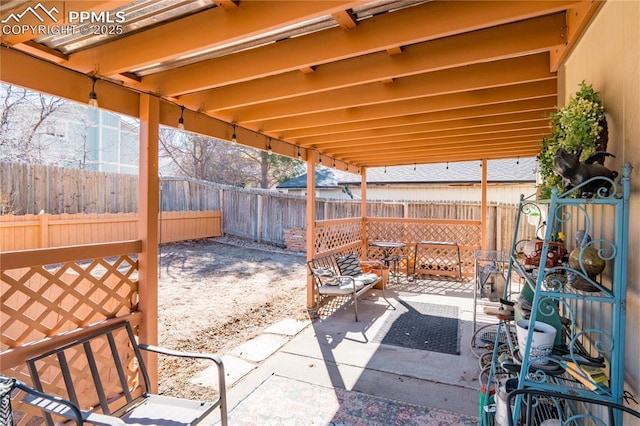 view of patio / terrace featuring fence