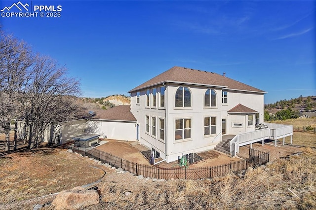 rear view of house with a patio area and a fenced backyard