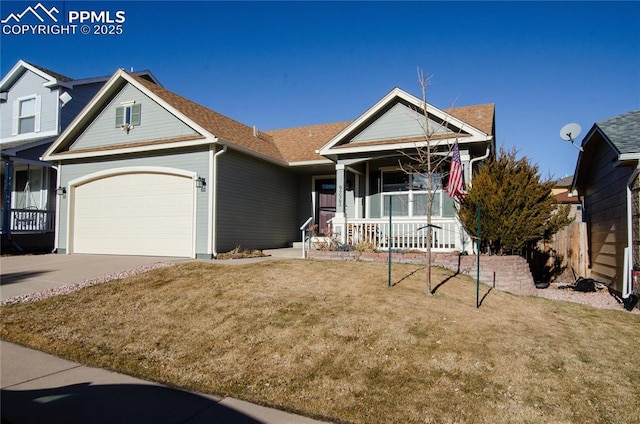 view of front of home featuring a porch, an attached garage, a front yard, and driveway