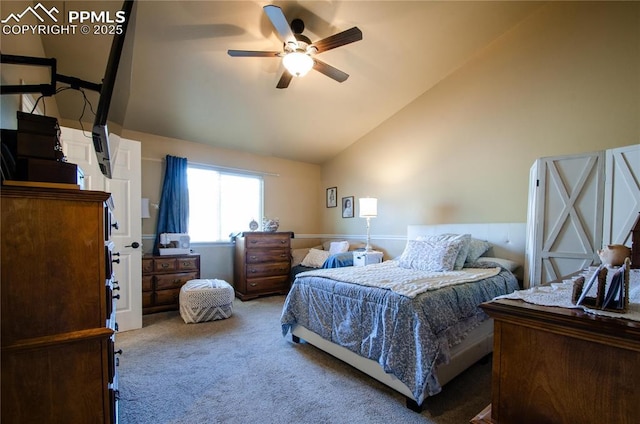 carpeted bedroom with vaulted ceiling and ceiling fan