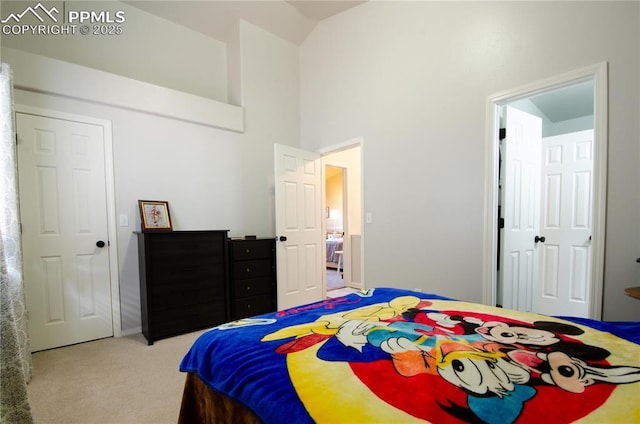 carpeted bedroom featuring a high ceiling