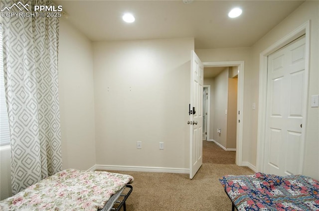 bedroom with recessed lighting, light colored carpet, and baseboards