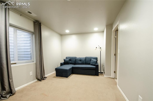 living area featuring recessed lighting, baseboards, and carpet floors