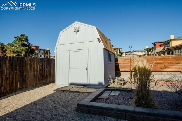 view of shed with a fenced backyard