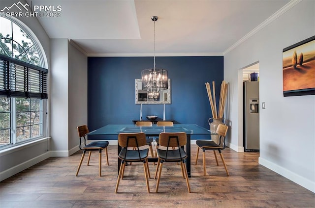 dining room with baseboards, dark wood-type flooring, and ornamental molding