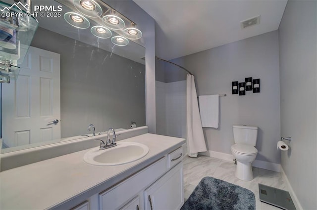 bathroom with marble finish floor, curtained shower, toilet, vanity, and baseboards