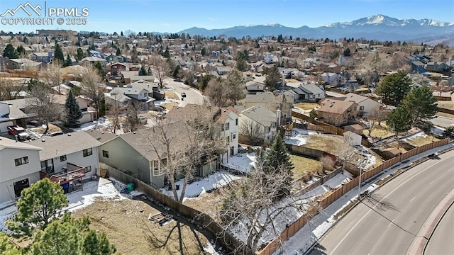 drone / aerial view featuring a residential view and a mountain view