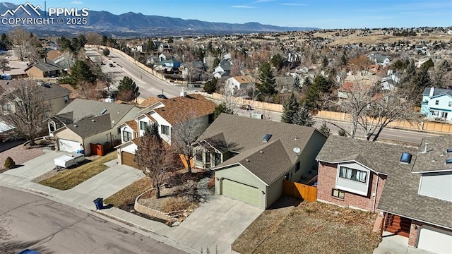 drone / aerial view with a mountain view and a residential view