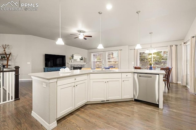 kitchen with a sink, lofted ceiling, dishwasher, and open floor plan