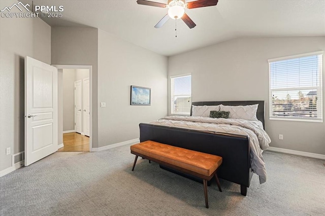 bedroom featuring baseboards, lofted ceiling, and carpet floors