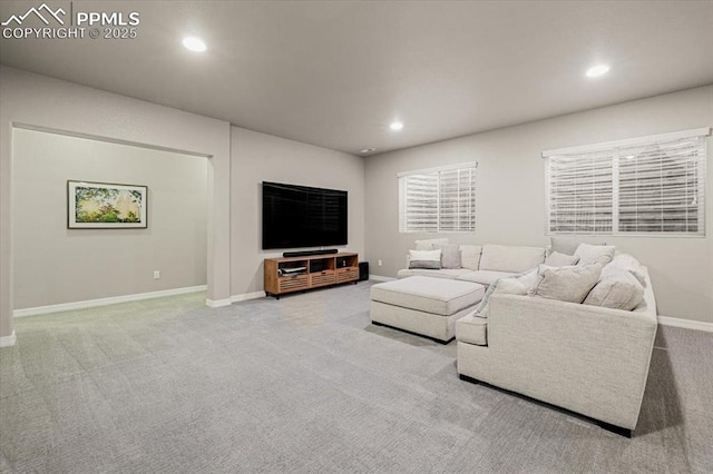 living room featuring recessed lighting, carpet, and baseboards