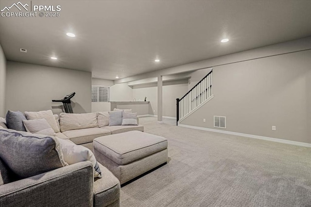 living area featuring visible vents, recessed lighting, baseboards, light colored carpet, and stairs