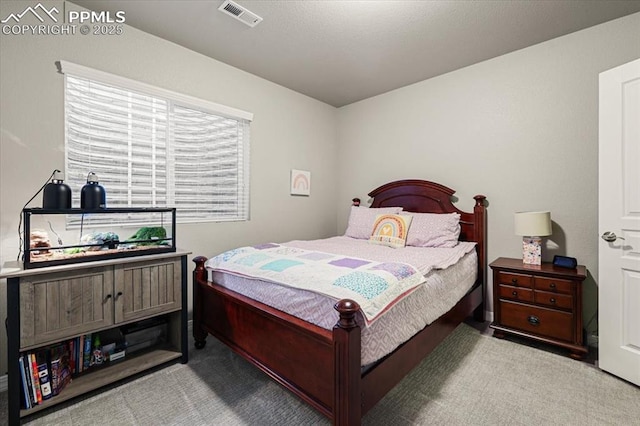 bedroom featuring visible vents and carpet