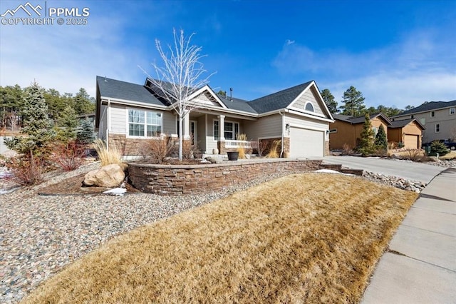 view of front of property featuring driveway and a garage