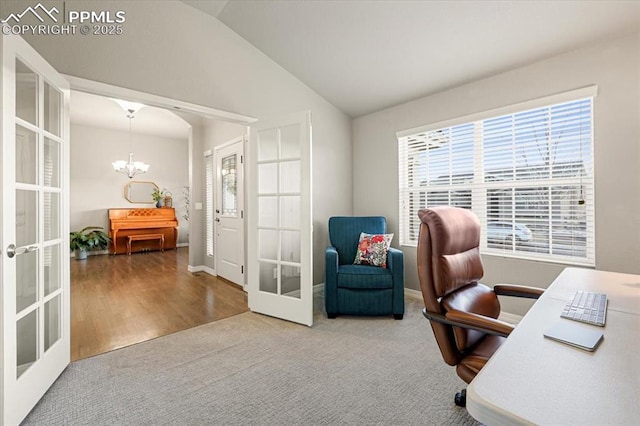 office area with a wealth of natural light, a chandelier, french doors, and vaulted ceiling