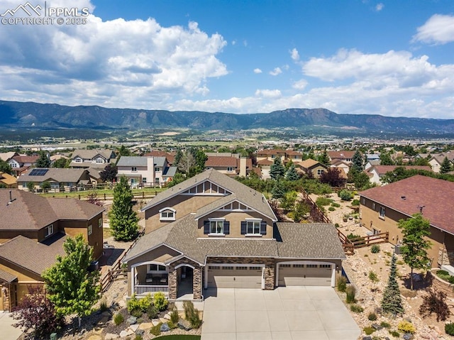 aerial view with a residential view and a mountain view