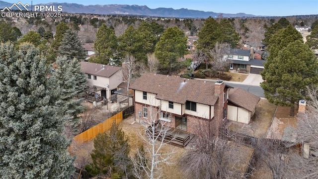 drone / aerial view featuring a residential view and a mountain view