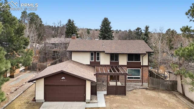 view of front of house featuring a garage, fence, driveway, roof with shingles, and a chimney