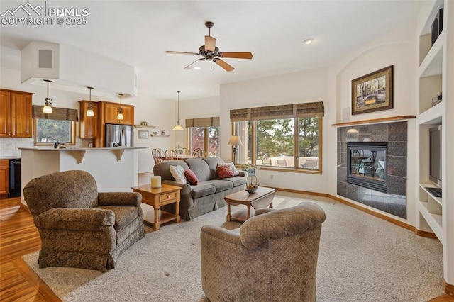 living room with recessed lighting, visible vents, ceiling fan, a tile fireplace, and baseboards