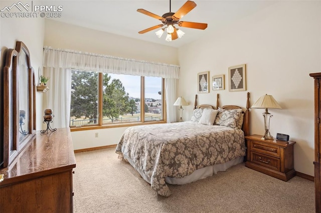 carpeted bedroom featuring ceiling fan and baseboards