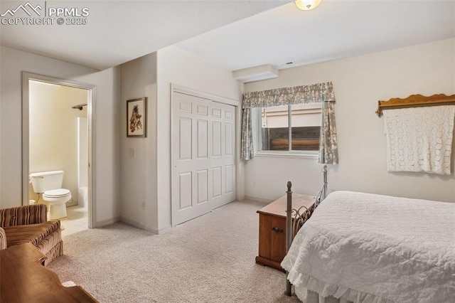 bedroom featuring light carpet, a closet, connected bathroom, and baseboards