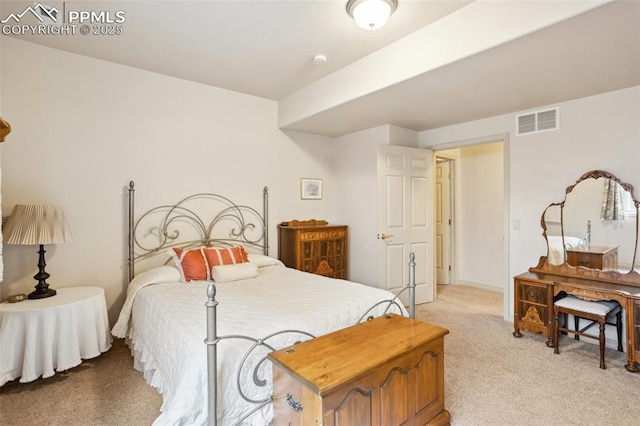 bedroom featuring light carpet and visible vents