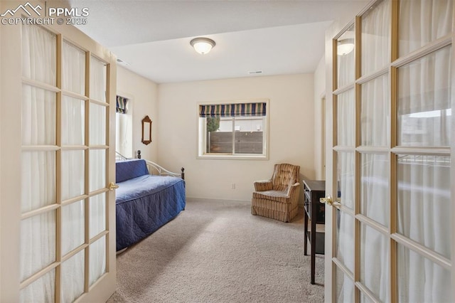 carpeted bedroom featuring french doors