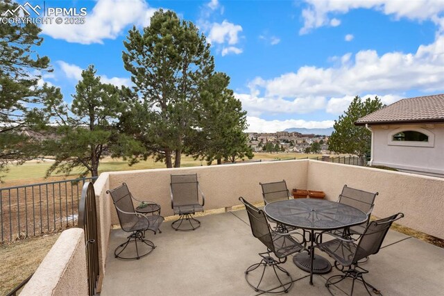 view of patio / terrace featuring fence and outdoor dining space