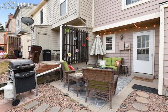 view of patio / terrace featuring an outdoor hangout area, area for grilling, and fence