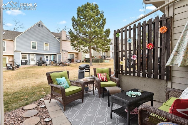 view of patio / terrace with a residential view and an outdoor hangout area