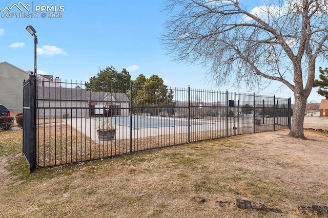 view of swimming pool featuring a patio area, a swimming pool, and fence