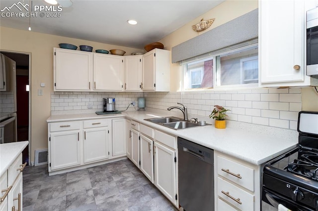 kitchen featuring white cabinets, appliances with stainless steel finishes, and a sink