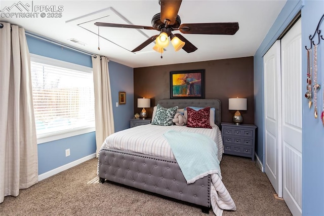 bedroom featuring visible vents, a ceiling fan, a closet, carpet flooring, and baseboards