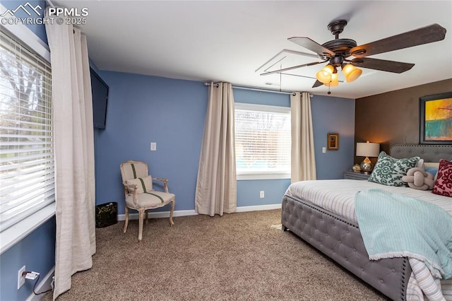 bedroom featuring a ceiling fan, carpet, and baseboards