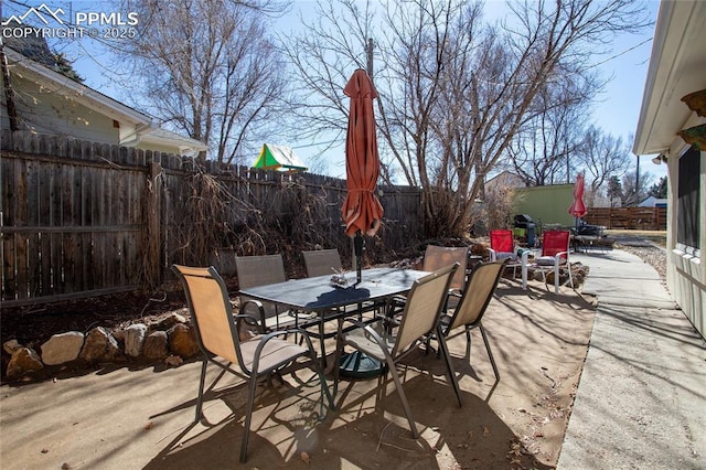 view of patio / terrace featuring outdoor dining area and a fenced backyard