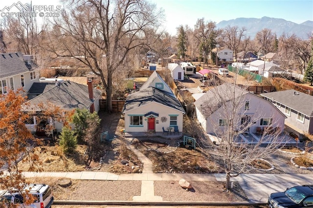 birds eye view of property with a residential view and a mountain view