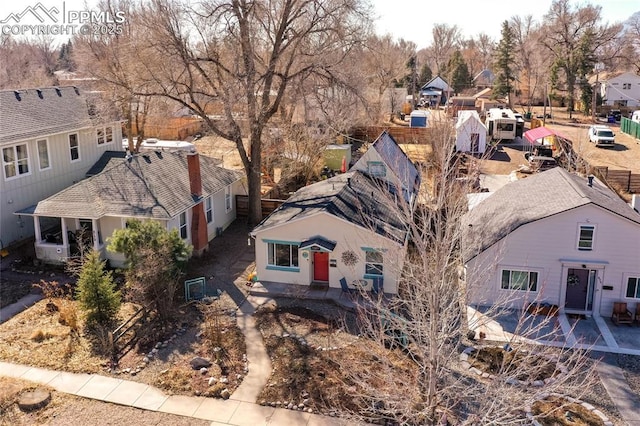 birds eye view of property with a residential view