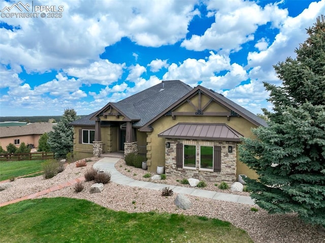 17820 Pioneer Xing, Colorado Springs, CO 80908 - craftsman-style house with stone siding, a standing seam roof, stucco siding, a front lawn, and metal roof