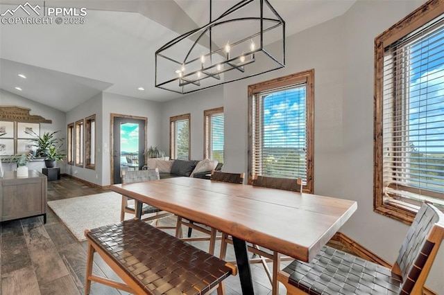 17820 Pioneer Xing, Colorado Springs, CO 80908 - dining area featuring healthy amount of natural light, wood finished floors, recessed lighting, lofted ceiling, and a chandelier