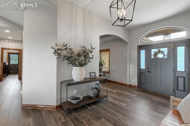 17820 Pioneer Xing, Colorado Springs, CO 80908 - foyer with arched walkways, wood finished floors, healthy amount of natural light, a chandelier, and recessed lighting