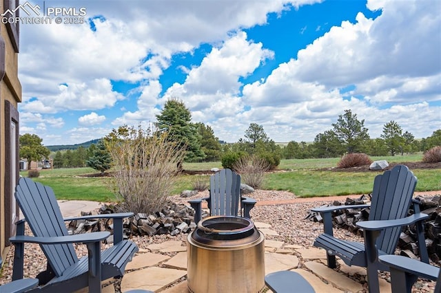 17820 Pioneer Xing, Colorado Springs, CO 80908 - view of patio / terrace with a fire pit