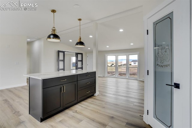 kitchen featuring baseboards, vaulted ceiling with beams, recessed lighting, hanging light fixtures, and light wood-type flooring