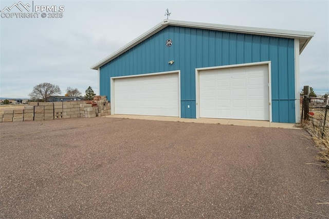 garage featuring fence