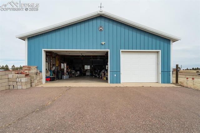 garage with fence