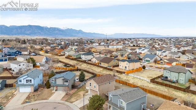 bird's eye view featuring a mountain view and a residential view