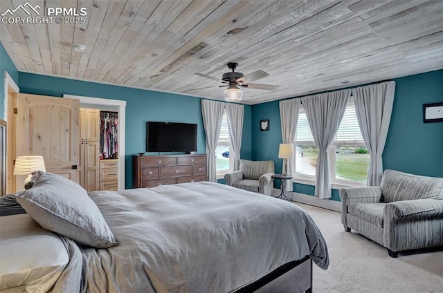 bedroom featuring ceiling fan, carpet, and wood ceiling