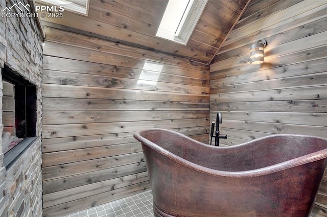 bathroom featuring a freestanding bath, a sauna, and lofted ceiling with skylight