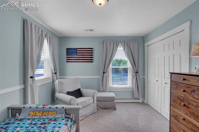 bedroom featuring multiple windows, carpet, a closet, and visible vents